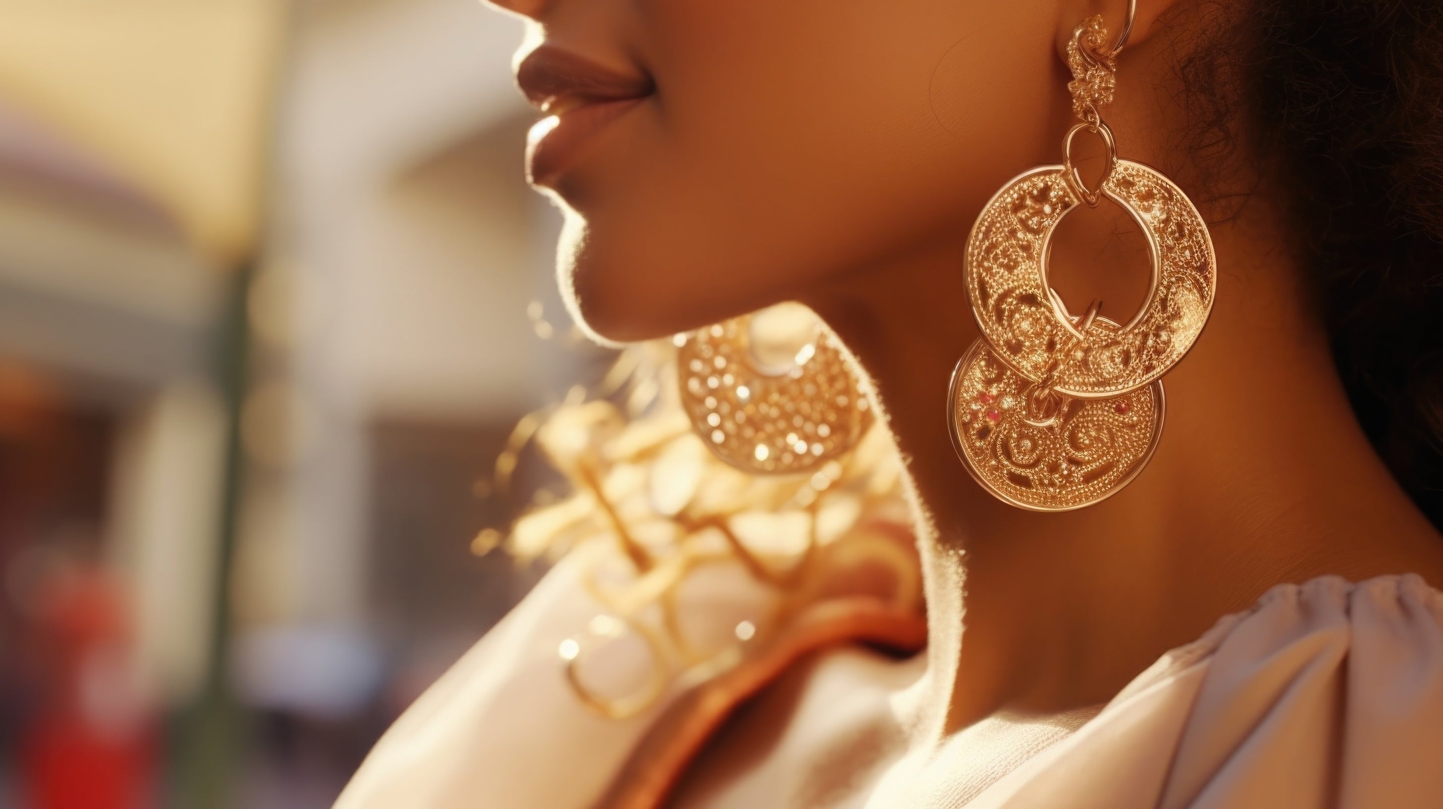 Elegant close-up of gold statement earrings worn by a woman, perfect for summer fashion styling.
